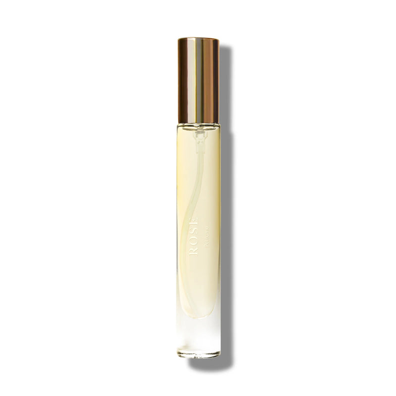 An image of a sleek perfume bottle with a golden cap, labeled "Caswell Massey Rose Perfume" in elegant script, presented on a bright white backdrop. The bottle appears elongated and simple in design.