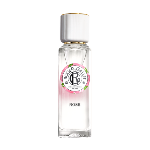 A clear glass bottle of Roger & Gallet Rose Wellbeing Fragrant Water, with a white cap and a label featuring pink and green accents with the name and scent prominently displayed.