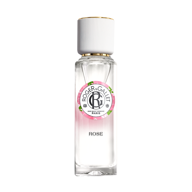 A clear glass bottle of Roger & Gallet Rose Wellbeing Fragrant Water, with a white cap and a label featuring pink and green accents with the name and scent prominently displayed.