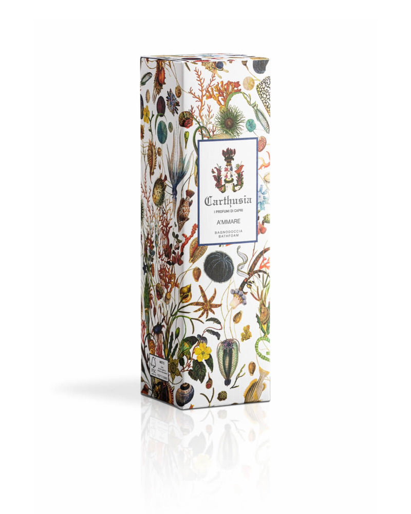 An ornately decorated perfume box with floral and botanical illustrations, featuring a label with the text "Carthusia I Profumi de Capri A'mmare Bath Foam" on a white background.