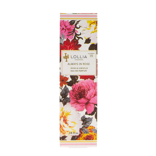 A rectangular perfume box labeled "Margot Elena Lollia Always in Rose Travel Eau de Parfum" decorated with vibrant floral prints in shades of pink, red, and orange with touches of green foliage.