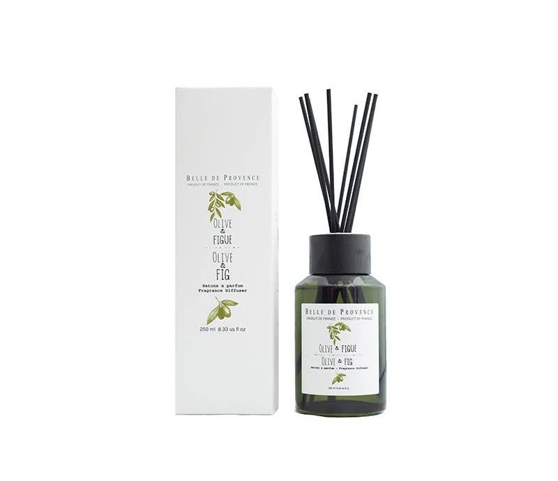 A Belle de Provence Olive & Fig 250mL Fragrance Diffuser from Lothantique is depicted, emitting earthy and herbal scents. The long-lasting diffuser comes in a green glass bottle with black reeds inserted and an accompanying white box adorned with olive branch illustrations and product details.