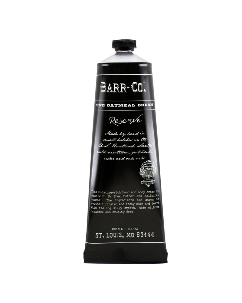 A luxurious black tube labeled "Barr-Co. Reserve Hand & Body Cream" with elegant white text, detailing its nature as a hand & body cream enriched with Shea butter. The product is placed against the Brand Name: Barr-Co.