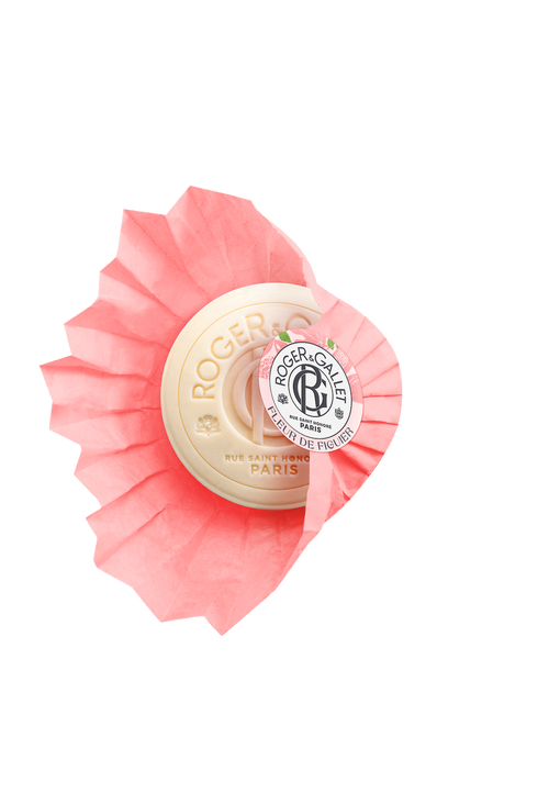 A wrapped bar of Roger & Gallet Fig Blossom soap on a solid background, with the packaging displaying a vibrant red and white embossed design and the logo at the center. This luxurious soap represents Roger & Gallet.