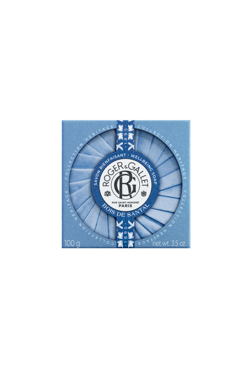 A bar of Roger & Gallet Sandalwood - Wellbeing Soap - 3.5 oz in a blue and white decorative box with a circular, striped pattern and the company's logo in the center.
