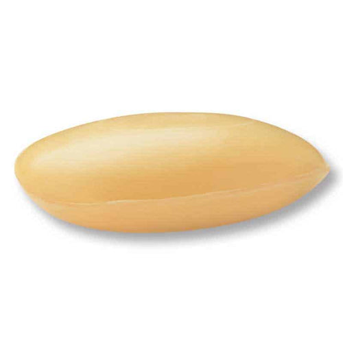 A single, smooth, oval-shaped La Lavande Sandalwood Galet French Soap with a light beige color and a slightly glossy surface. It appears isolated on a white background with a subtle shadow underneath it, reminiscent of the purity found in all-natural vegetable oils.