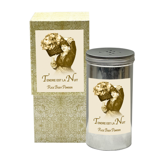 Vintage style La Bouquetiere Tendre est la Nuit rice body powder packaging with an illustration of a woman holding flowers on both the cardboard box and cylindrical container. The design features elegant floral and ornate patterns, highlighting its luxurious skin pampering qualities.