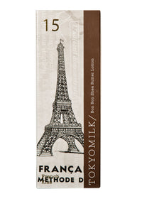 A Margot Elena TokyoMilk French Kiss No. 15 Bon Bon Shea Butter Lotion packaging featuring a sketch of the Eiffel Tower with the text "Franca Methode d" and "15 TokyoMilk." The package has a brown side panel.