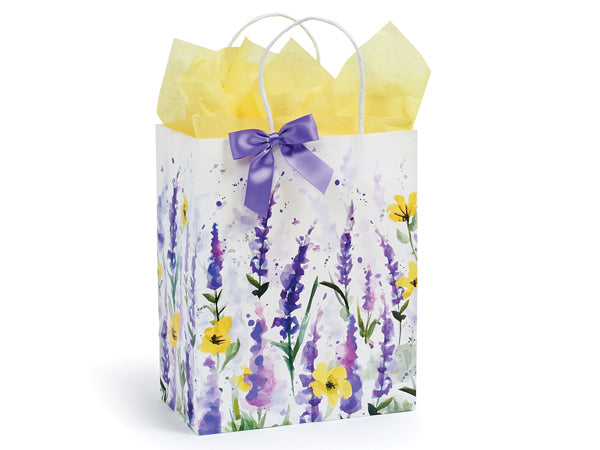 A Nashville Wraps Watercolor Lavender Gift Bag adorned with a watercolor floral design of lavender and yellow flowers, complemented by a purple ribbon and yellow tissue paper peeking out from the top.