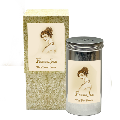 La Bouquetiere Vintage-style body powder packaging featuring a classical image of a woman on the labels and an ornate tin shaker. The main colors are beige and grey with orange blossom floral patterns.