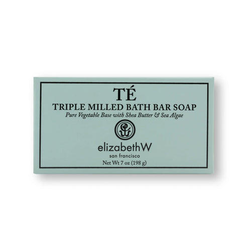 A rectangular bath bar soap packaging labeled "elizabeth W Signature Té Soap Bath Bar" by Elizabeth W, highlighting ingredients like shea butter & sea algae, set against a soft green background.
