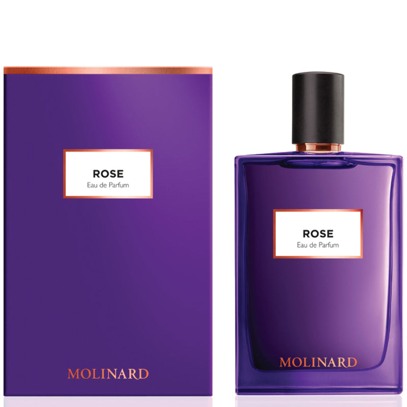 A purple bottle of Molinard Rose Eau de Parfum next to its matching box. The bottle has a black cap and label with white and orange text.