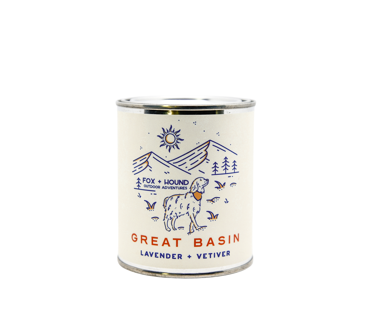 A cylindrical odor-eliminating Fox + Hound Lavender + Vetiver National Parks Great Basin soy candle in a metal tin labeled with illustrations of mountains, stars, trees, a sun, and a dog on the.