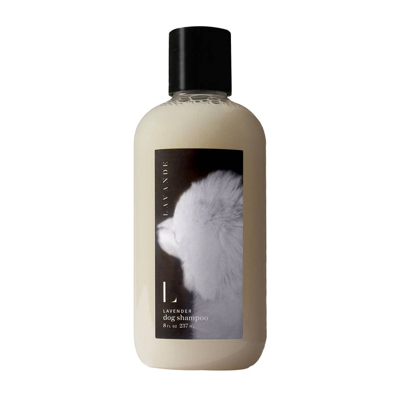 A bottle of Lavande Lavender Dog Shampoo with a black cap. The label displays an image of a fluffy white dog and indicates the content is 8 oz (237 ml).