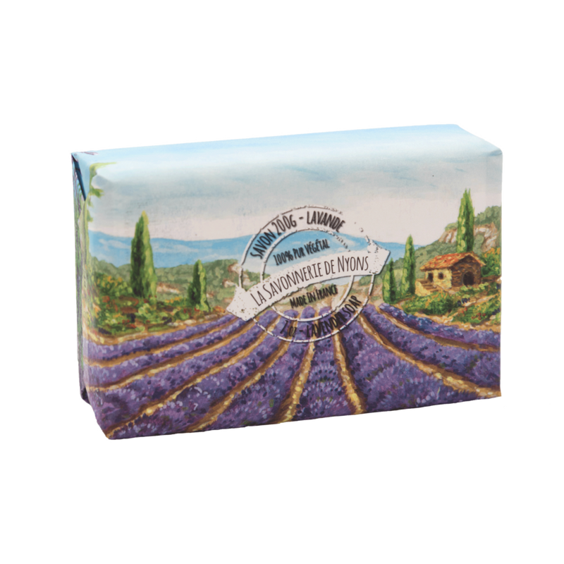 A soap box illustrated with a vibrant lavender field landscape featuring a small house under a clear sky, labeled "La Savonnerie de Nyons" in an elegant font and highlighted as Lavender scented soap