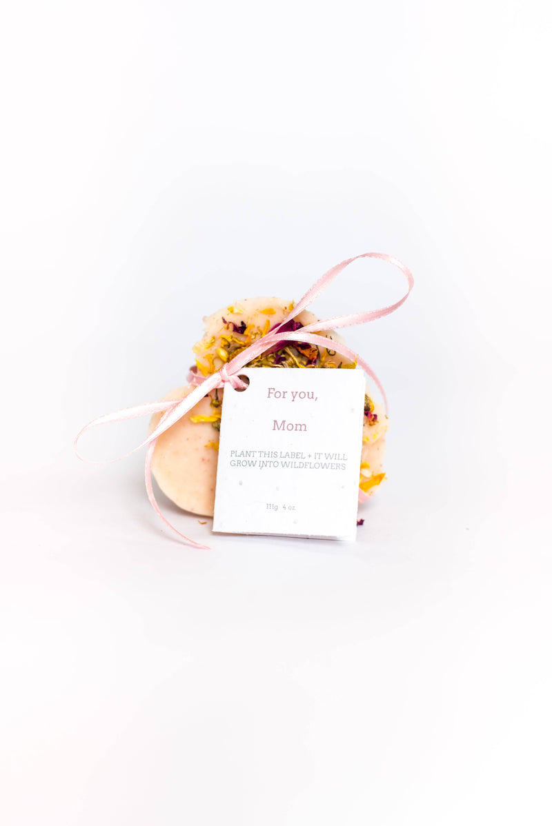 A SOAK Bath Co. - Heart Shaped Soap tied with a pink and white string and a tag reading "for you, mom" against a white background, ideal as a sustainable gift for mom. The tag notes the.SOAK Bath Co.