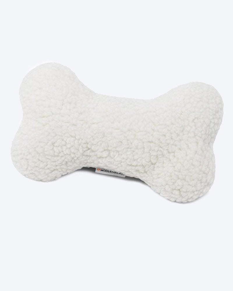 A fluffy, white, MODERNBEAST Lavender Zenbone - Midnight Floral dog pillow with a visible brand tag against a plain white background.