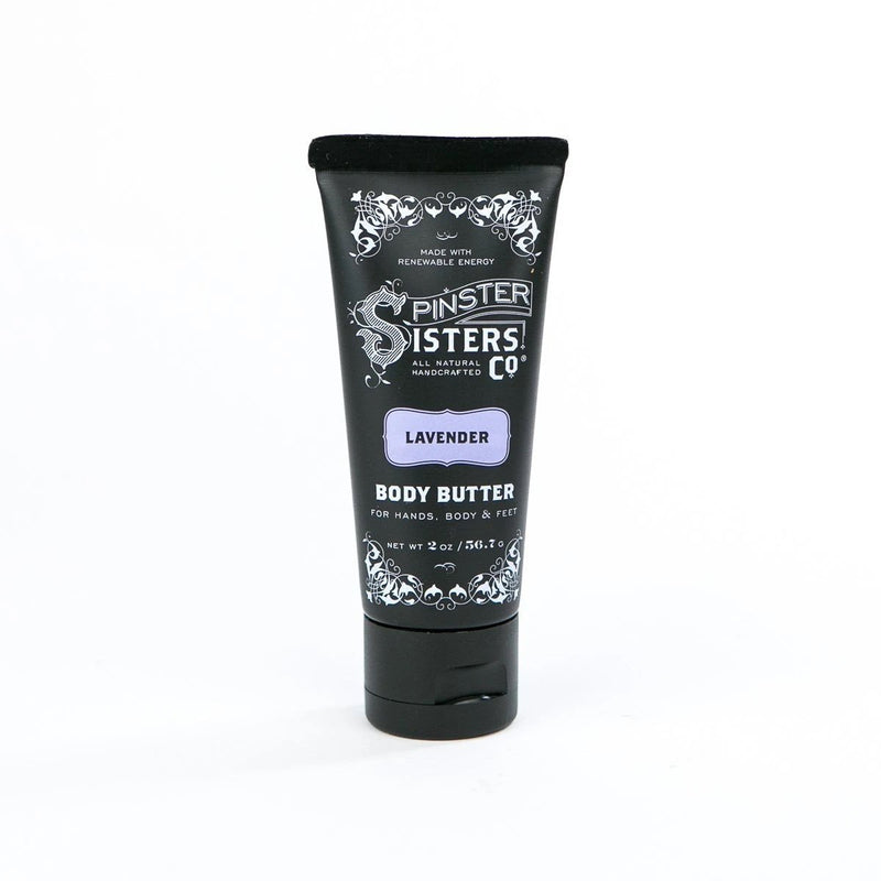 A black tube of Spinster Sisters Co. Lavender body butter containing Shea Butter, labeled for hands, body, and feet, with a lavender scent, on a white background.