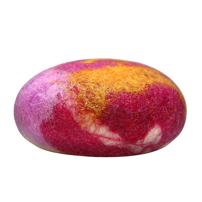 A vividly colored Fiat Luxe - Citrus Spice felted soap stone featuring swirling patterns of pink, magenta, and yellow against a white background.