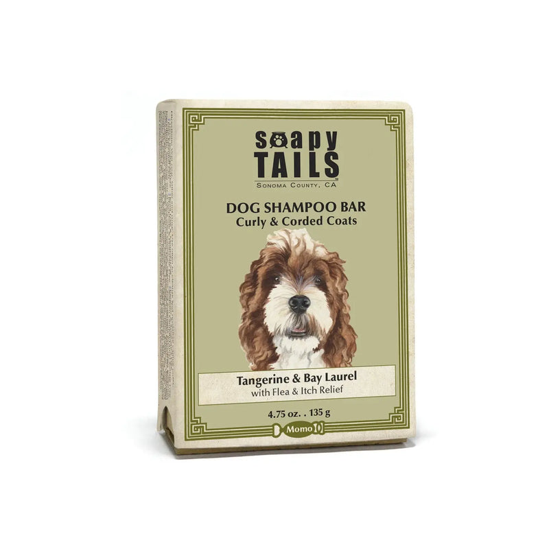 A dog shampoo bar labeled "Three Sisters Apothecary Soapy Tails Tangerine & Bay Laurel Dog Shampoo Bar for Curly & Corded Coats", featuring an illustrated brown and white dog on a green and beige box. Now enhanced with a