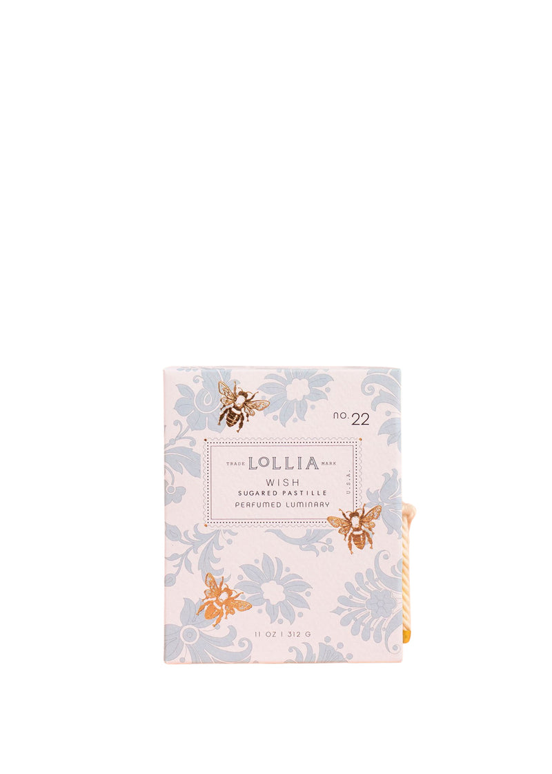 A box of Margot Elena Lollia Wish No. 22 Luminary Candle, featuring a floral design with butterflies, presented on a soy wax & coconut wax blend background.