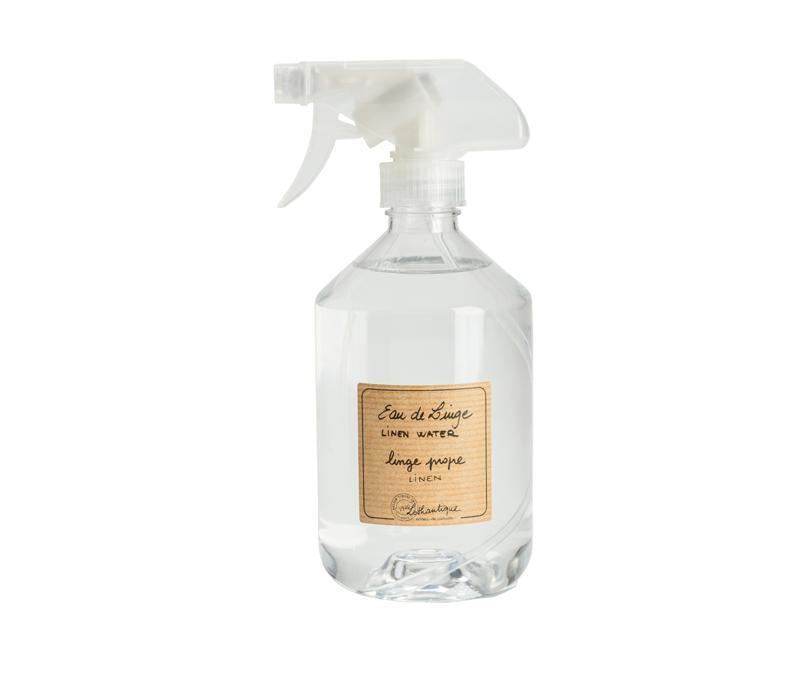 A clear spray bottle containing Lothantique Linen Water - Linen, with a vintage-style beige label indicating natural linen fragrance, Made in France.