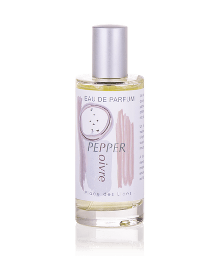 A transparent fragrance bottle labeled "Place des Lices Pepper Eau de Parfum" by Place des Lices, filled with yellowish liquid, viewed against a solid light blue background.