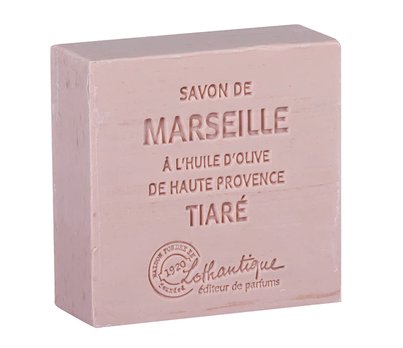A pink bar of Lothantique Les Savons de Marseille 100g Soap Tiara with embossed text detailing its origins and fragrance, presented against a plain background.