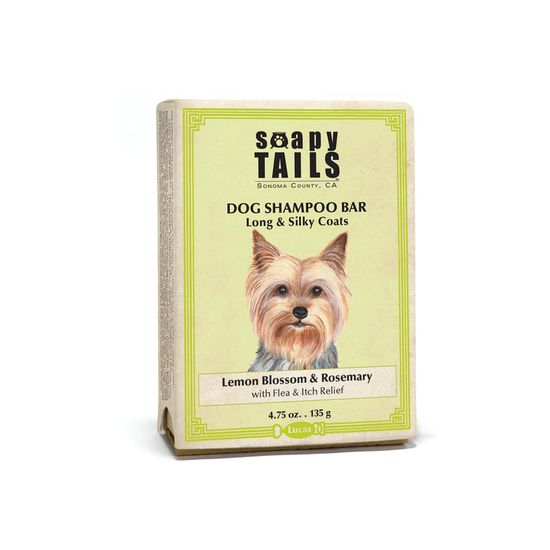 A dog shampoo bar called Three Sisters Aphothecary Soapy Tails, designed for long and silky coats, featuring a moisturizing formula flavored with lemon blossom and rosemary, showing an illustrated Yorkshire Terrier on the label.