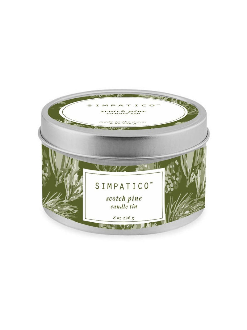A circular candle tin labeled "Simpatico" in bold text, featuring a pine scent. The tin has a green leafy design with white labeling. It contains an 8 oz natural soy candle.