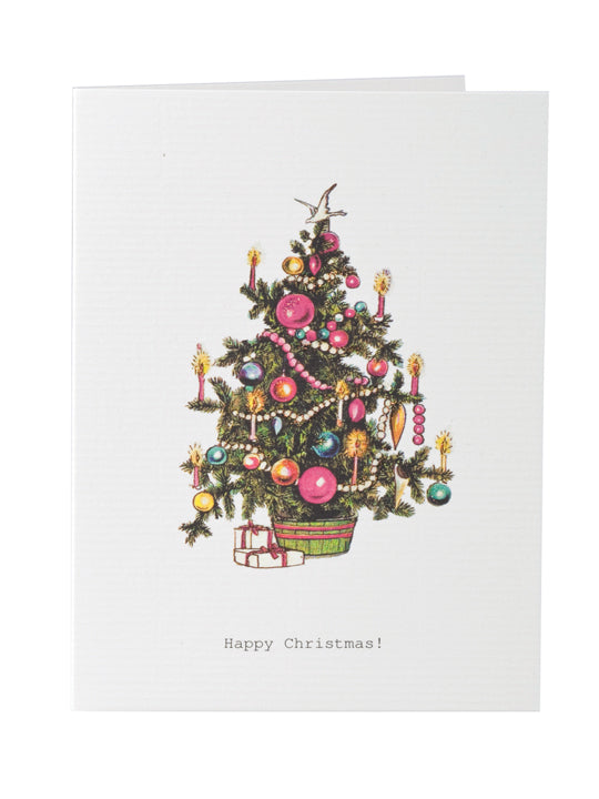A TokyoMilk Greeting Card featuring a detailed illustration of a richly decorated Christmas tree with colorful ornaments, a star on top, and hand-glittered accents, with a greeting that says "Happy Christmas!" at - Margot Elena