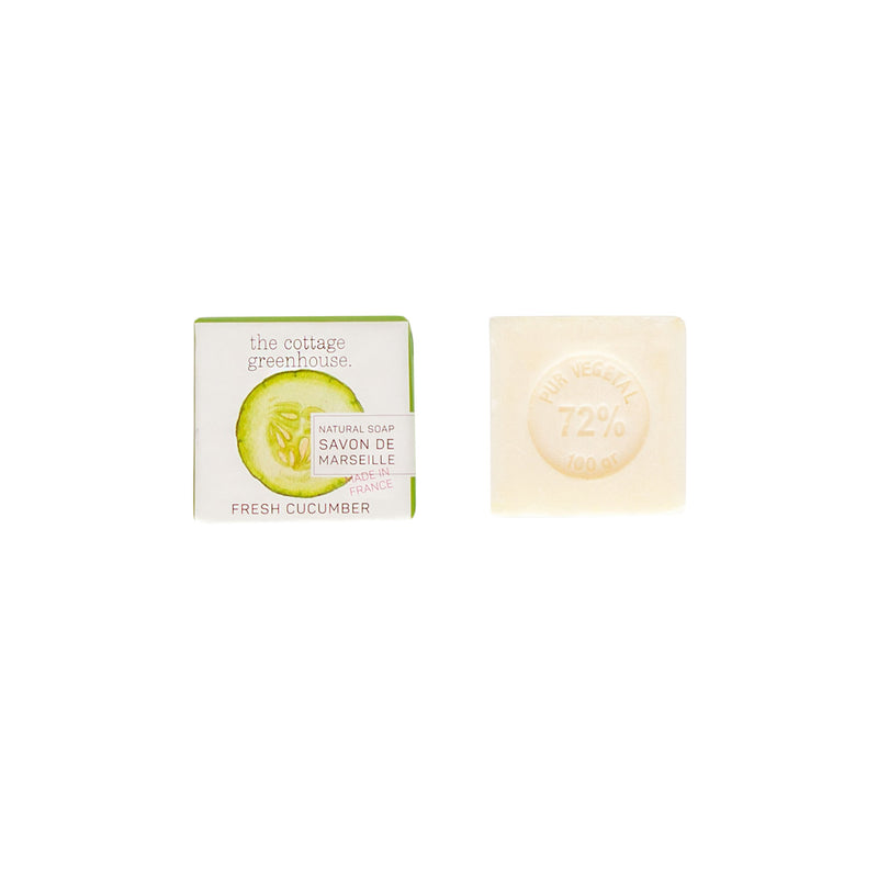 Two bars of soap on a white background; one labeled "The Cottage Greenhouse Fresh Cucumber Soap" in a green box by Margot Elena, the other a plain beige bar with "72% vegetable, 100 g".