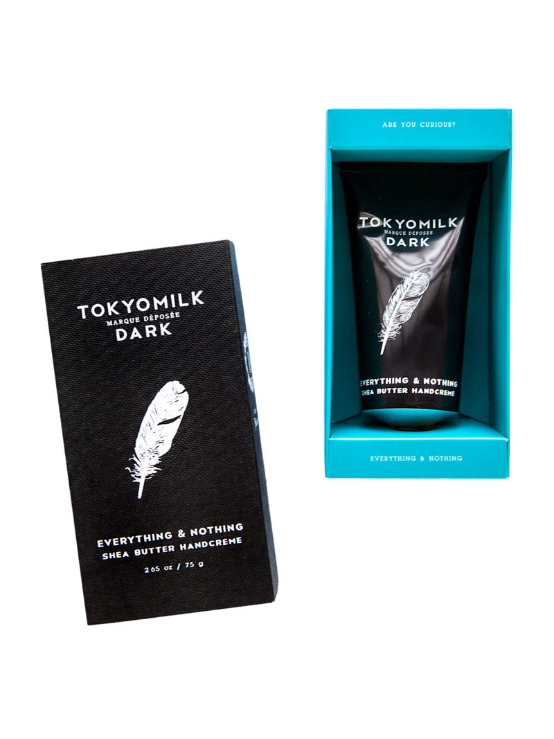 Two Margot Elena TokyoMilk Dark Everything & Nothing Handcreme packages on a white background; one in black with a feather design, labeled 'everything & nothing shea butter handcreme', and the other