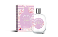 An image of Le Parfum Français Flora Bloom Eau de Toilette 3.5 fl oz bottle, labeled "flora bloom," next to its pink packaging box adorned with flowers and labeled "le parfum francais." The design includes elegant, subtle floral graphics that.