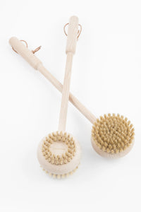 Two Andrée Jardin Beechwood Handle Bath & Body Brushes with long wooden handles on a white background.