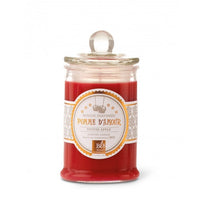 A red Bougies La Francaise scented candle in a glass jar with a lid, labeled "apple of love candle," which translates to "toffee apple." The candle is designed for a cozy, aromatic atmosphere.