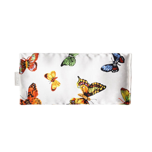 A rectangular fabric clutch with a vibrant print featuring the elizabeth W Silk Eye Pillow - Butterfly on a white background, perfect for holding lavender-filled eye pillows during meditation.