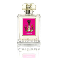 A clear glass perfume bottle with a gold cap and a vibrant pink label featuring the text "Carthusia Tuberosa Eau de Parfum" and a classical, decorative illustration of a deer and floral motifs by Carthusia I Profumi de Capri.