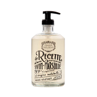 A refillable glass bottle of Panier Des Sens Collector Glass Bottle Relaxing Lavender Liquid Soap with a pump dispenser, showcasing elegant black and brown script detailing the product's 97% natural origin.