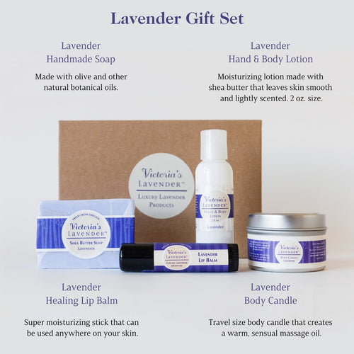 Image displays a set of Victoria's Lavender - Lavender Moisturizing Body Care Gift Set including handmade soap, hand lotion, lip balm, and a massage candle, all branded "Victoria's Lavender". The items are arranged neatly.