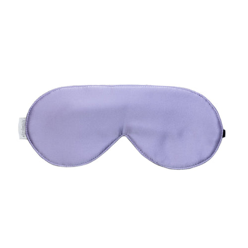 A elizabeth W lavender-colored silk sleep mask with an adjustable velvet strap isolated on a white background.