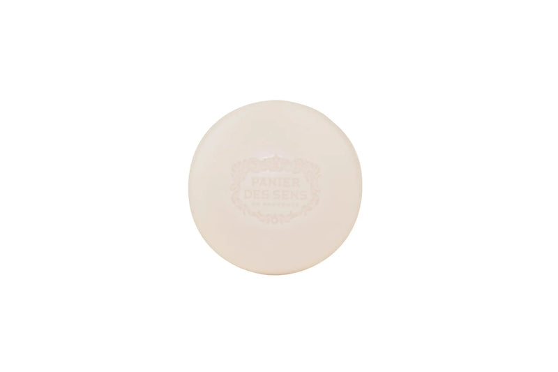 A single oval-shaped bar of Panier des Sens L’Olivier Shaving Soap with the embossed logo "Panier Des Sens" centered on it, presented against a plain white background.