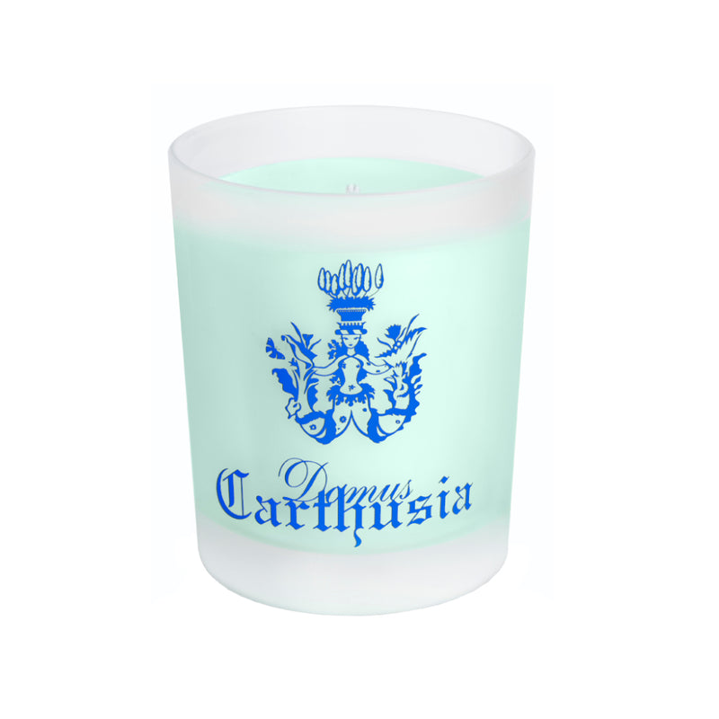 A blue Carthusia I Profumi de Capri scented candle in a frosted glass container with a light green wax, featuring a decorative crest design on the front.