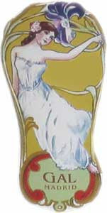 Vintage art nouveau-style tin with an illustration of a woman in a flowing white dress holding a purple flower. The background is yellow with green accents. Text reads "GAL MADRID" at the bottom.
