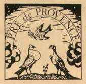 Vintage illustration with two birds on a branch and a flying bird holding an olive branch above. The text reads "Pré de Provence" in an arch shape at the top.
