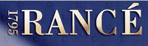 The image shows the text "RANCÉ 1795" in elegant gold lettering on a gradient blue background.
