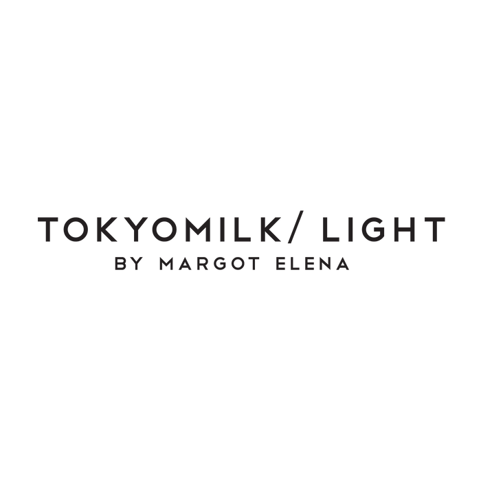 Text reading "TOKYOMILK / LIGHT BY MARGOT ELENA" in black capital letters on a white background.