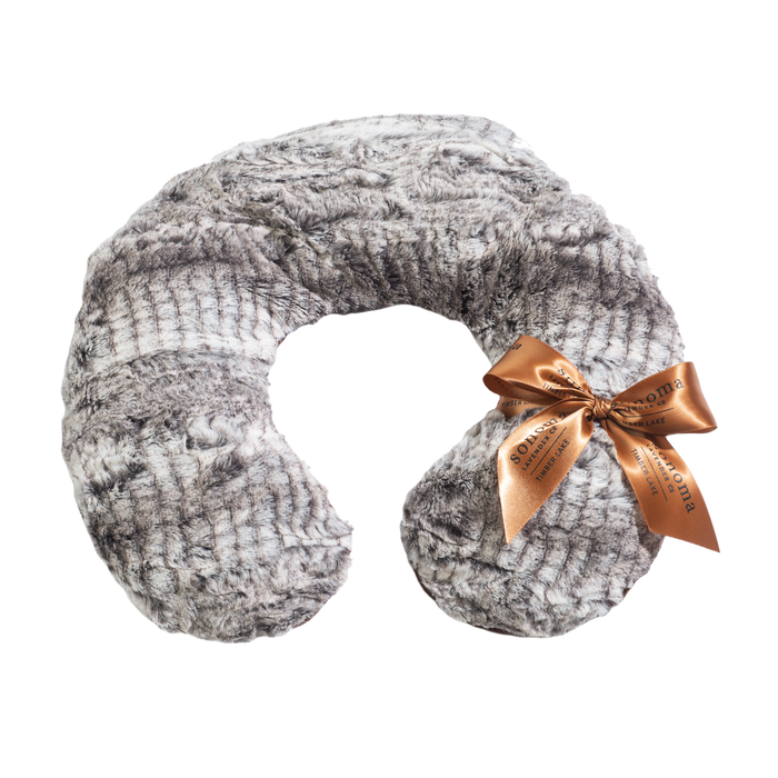 Gray, textured neck pillow with a soft, fur-like appearance, adorned with an orange satin ribbon tied in a bow. The ribbon features gold lettering.