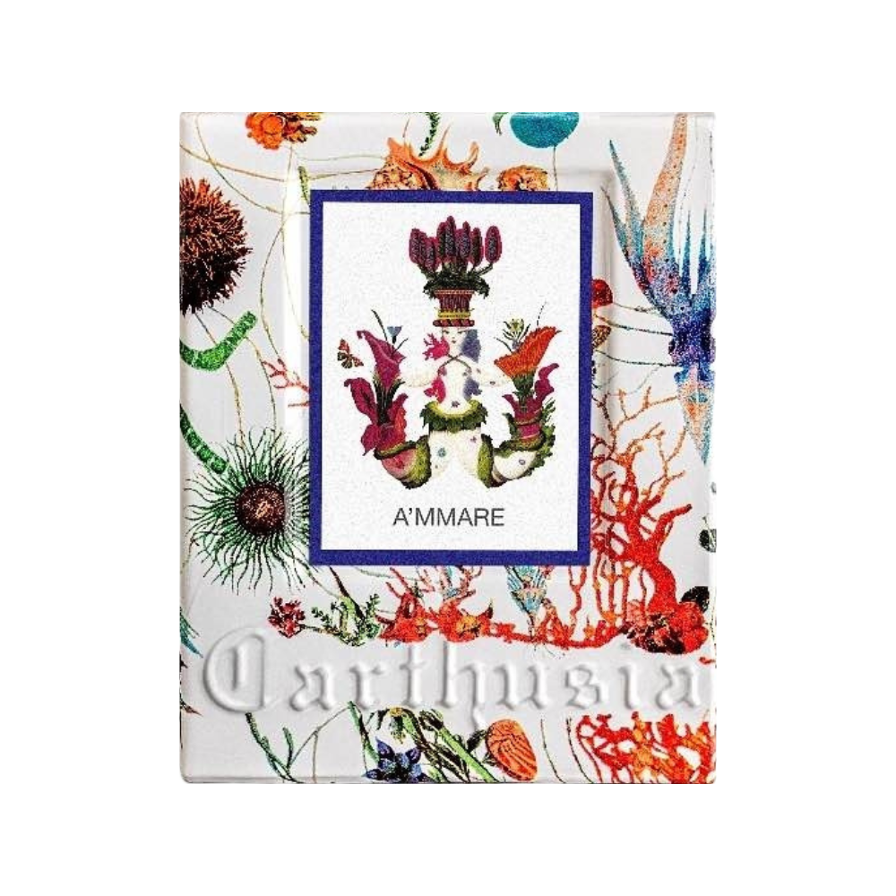 Colorful perfume packaging with a botanical theme, featuring various sea plants and corals. Central artwork enclosed in blue border. "A'MMARE" and "Carthusia" text visible. Predominantly white background.