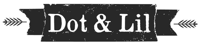 A black banner with a distressed texture featuring white text that reads "Dot & Lil." Two arrows point inward from each side of the banner.